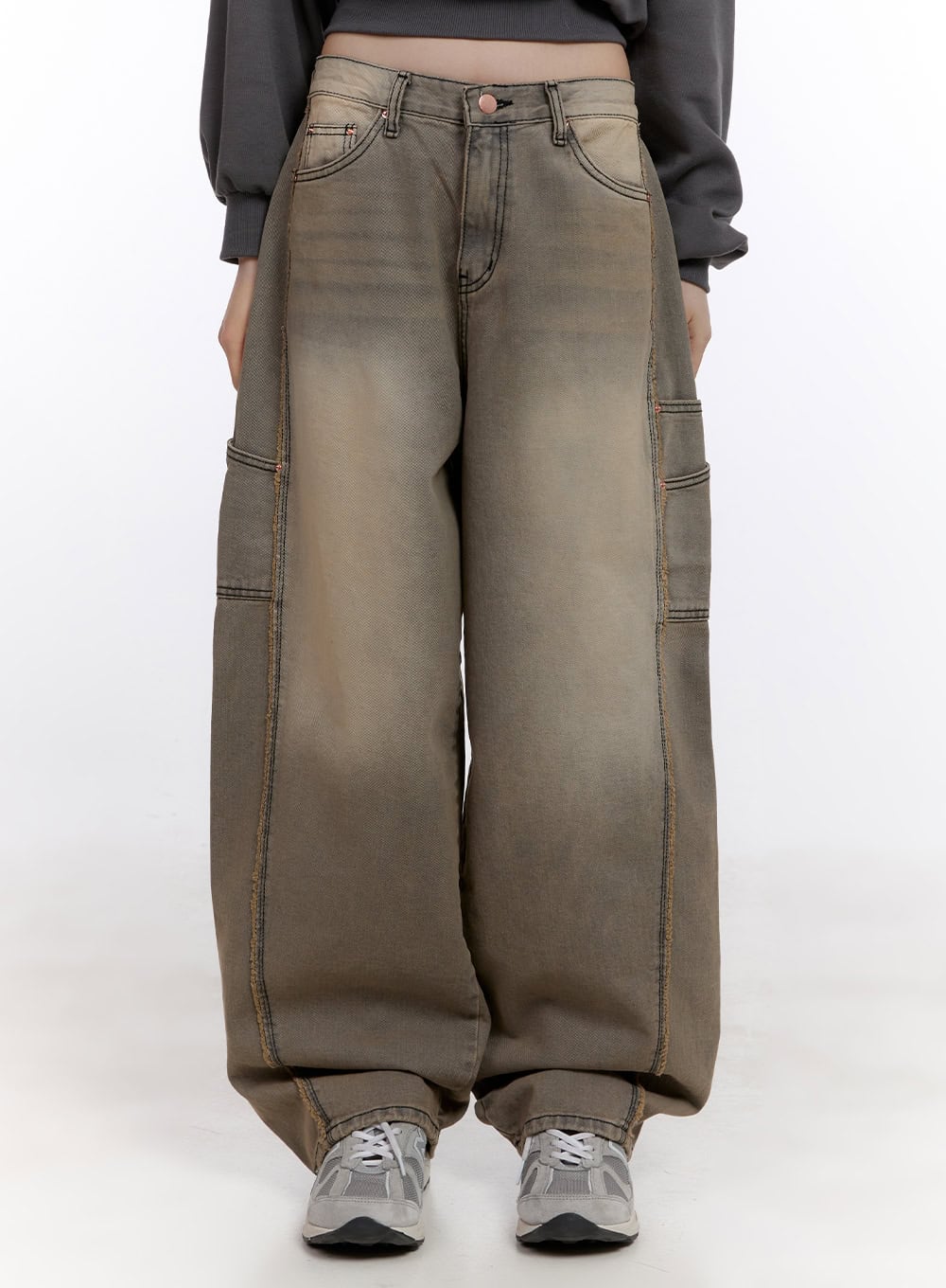 Sara Stitched Pocket Baggy Jeans CF512 in Beige, front close-up on model from waist to hem, wide-leg washed denim showing stitched seams and front pockets, with sneakers.