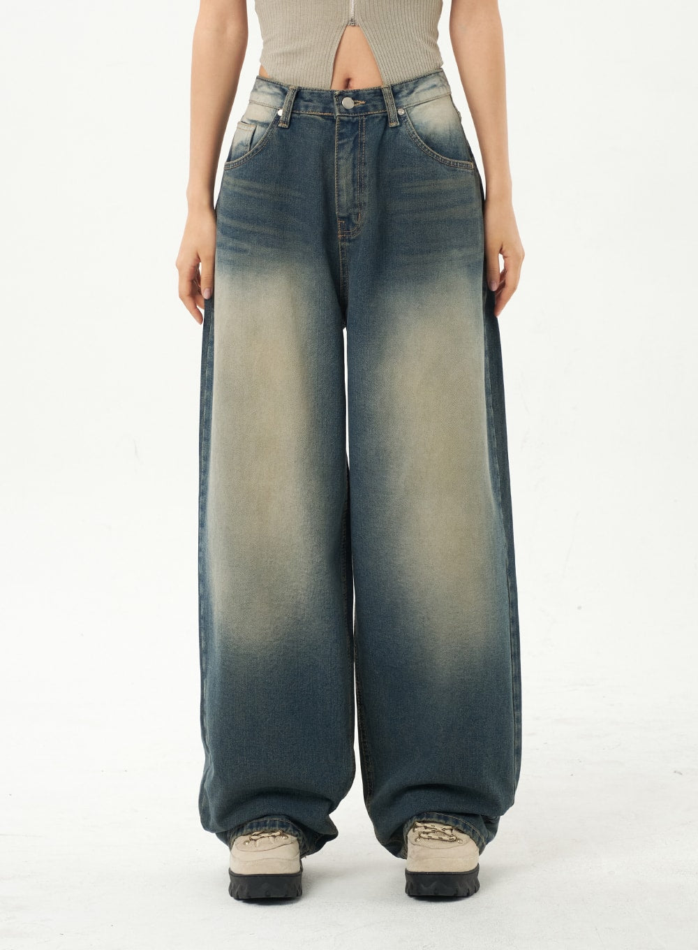 Mid-Rise Baggy Jeans CA325 in vintage blue denim, front waist-to-hem close-up on model, sun-faded wash with contrast stitching and five-pocket design, extra-wide leg pooling at ankle.
