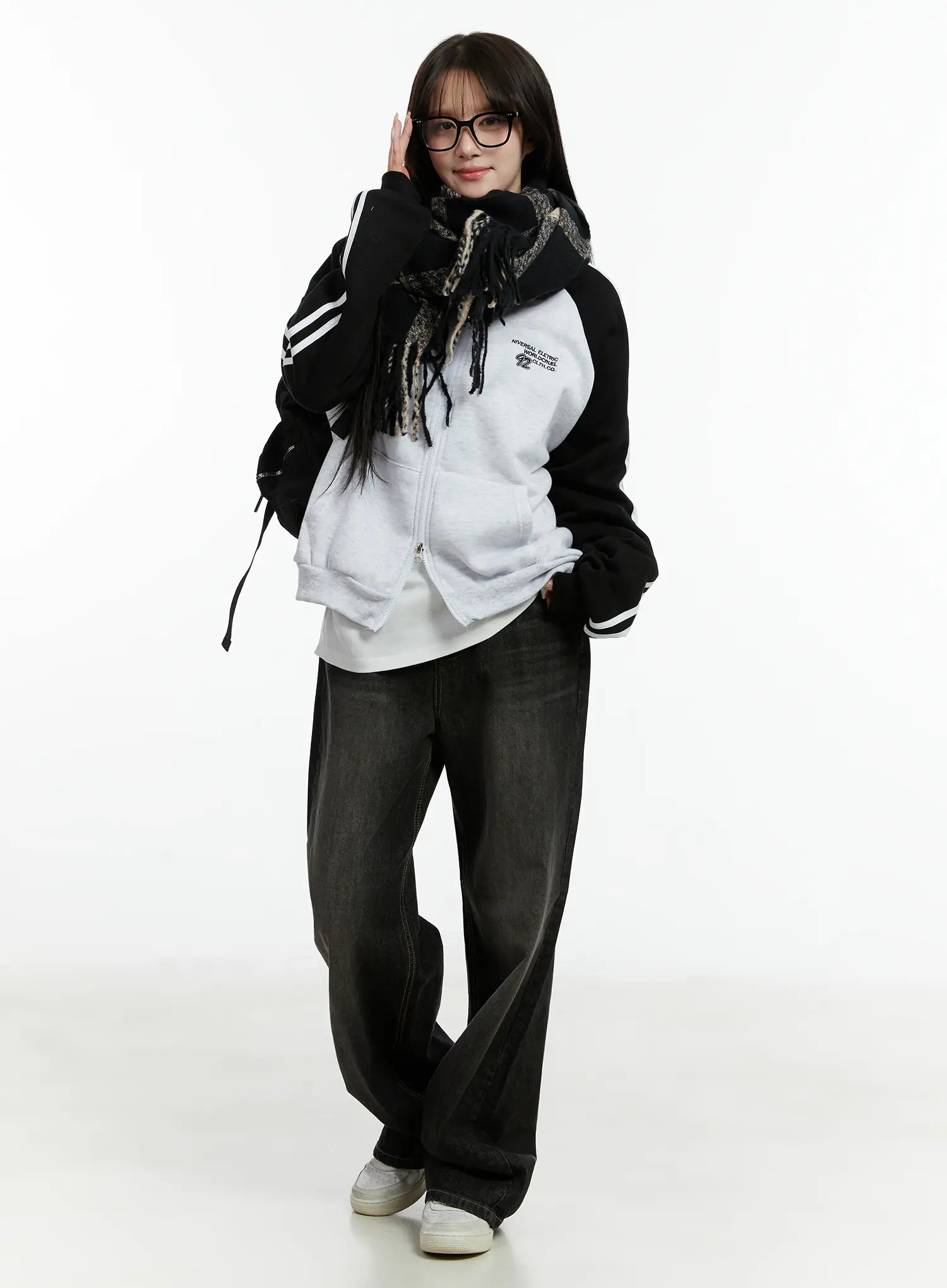 Haze Washed Wide-Leg Jeans CD523 in black, full-body styled shot on model with scarf and zip-up hoodie, relaxed wide-leg silhouette pooling at white sneakers.