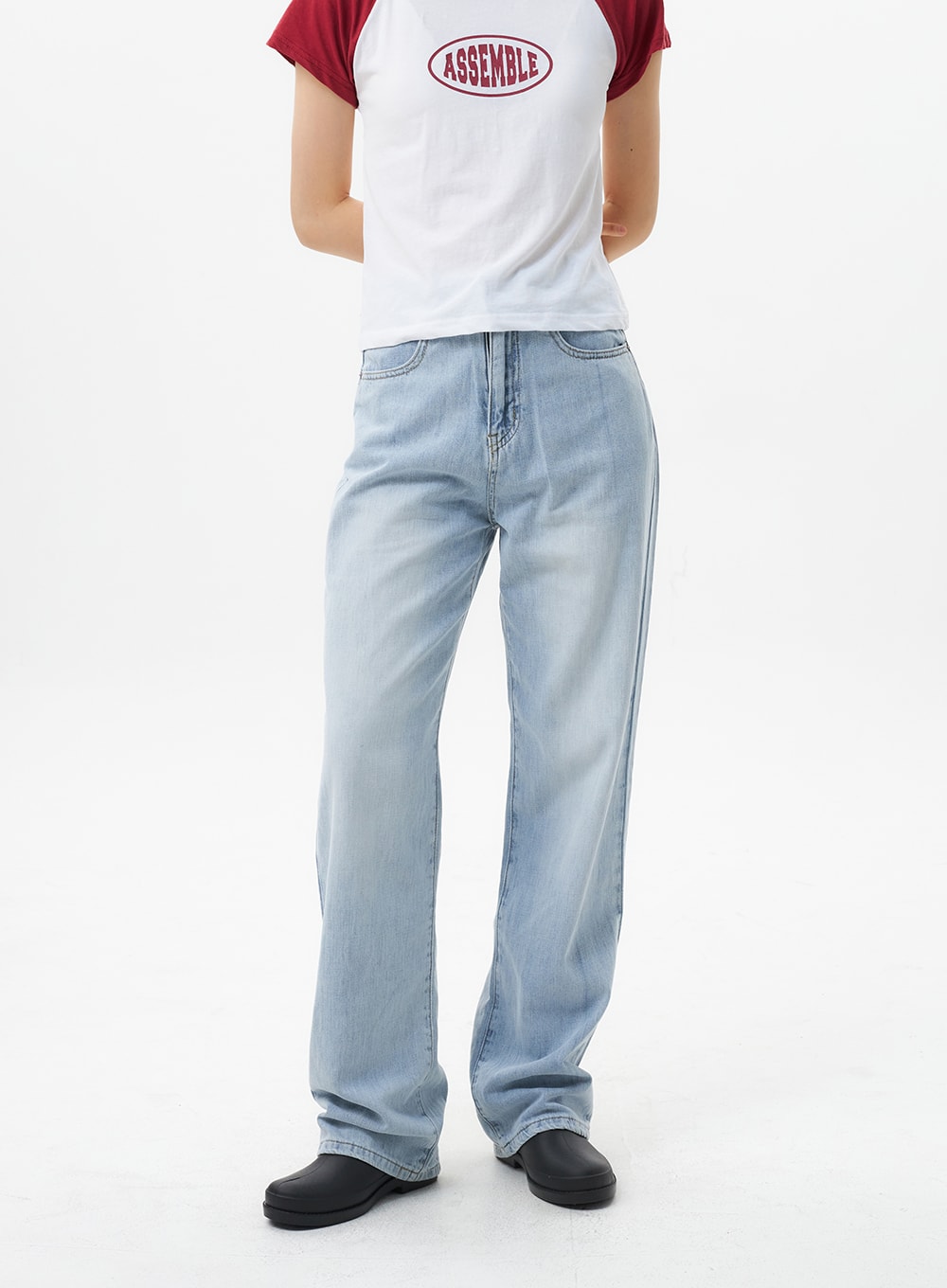 Wide Straight Leg Jeans OL304 in light blue, front waist-to-hem close-up on model, straight wide-leg silhouette, faded wash cotton denim with five-pocket styling and clean hem.
