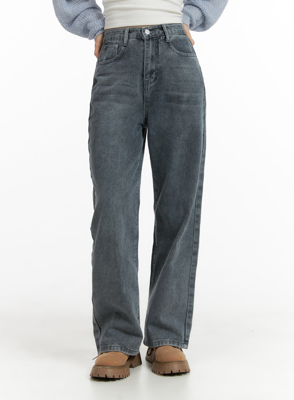 Blue Washed Straight Jeans OM408 in gray, front mid-shot on model, straight-fit washed denim with five-pocket design and button closure, paired with chunky boots.