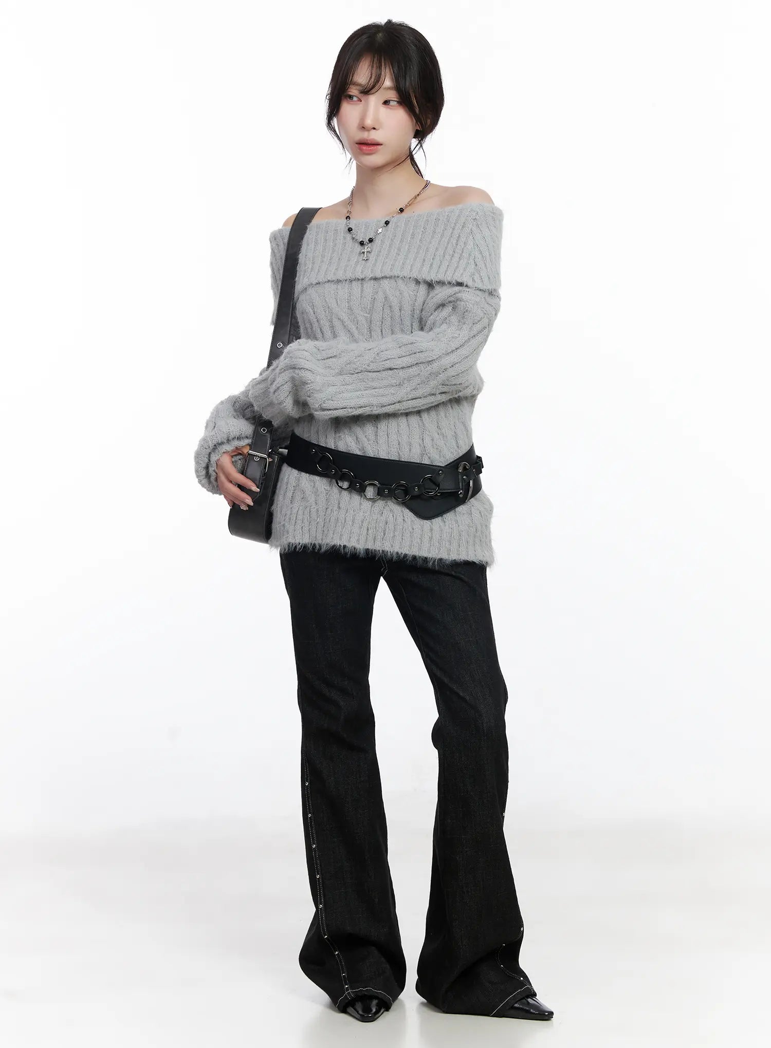 Dahy Stylish High-Waisted Bootcut Jeans CJ526 in black, full-body angled shot on model styled with grey off-shoulder cable knit and black belt bag, side stud seam detail visible.