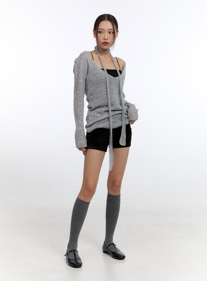 SlimFit Solid Shorts CO431 in black, full-body front shot on model, slim micro shorts paired with grey scarf knit top, black cami, and grey knee-high socks.