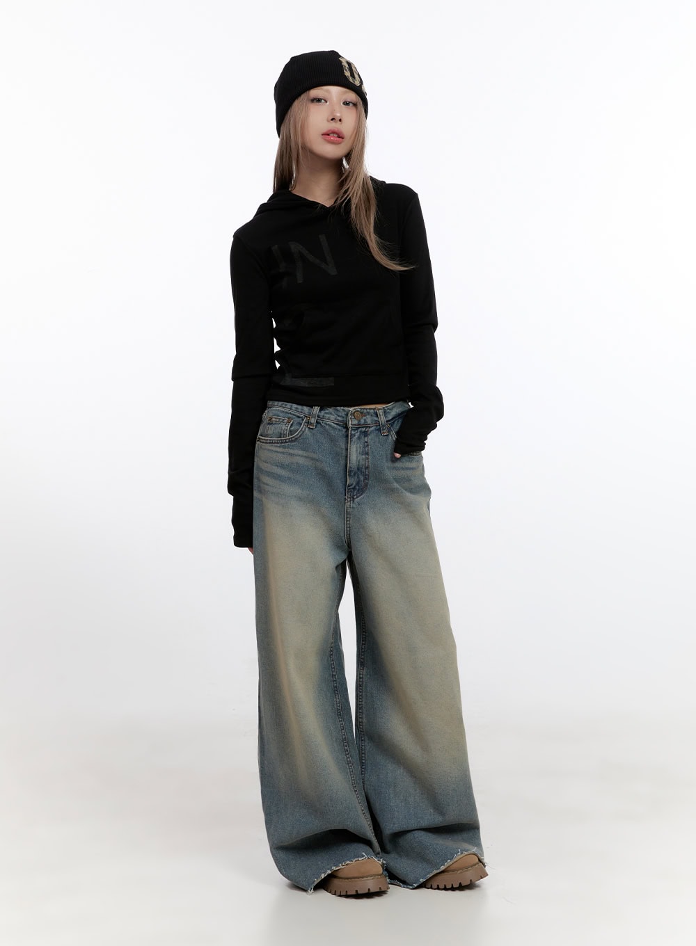 Felicia Cotton Wide Fit Baggy Jeans CN425 in blue, full-body front on model, petite fit, washed wide-leg denim pooling at floor, styled with black cropped hoodie and black beanie.