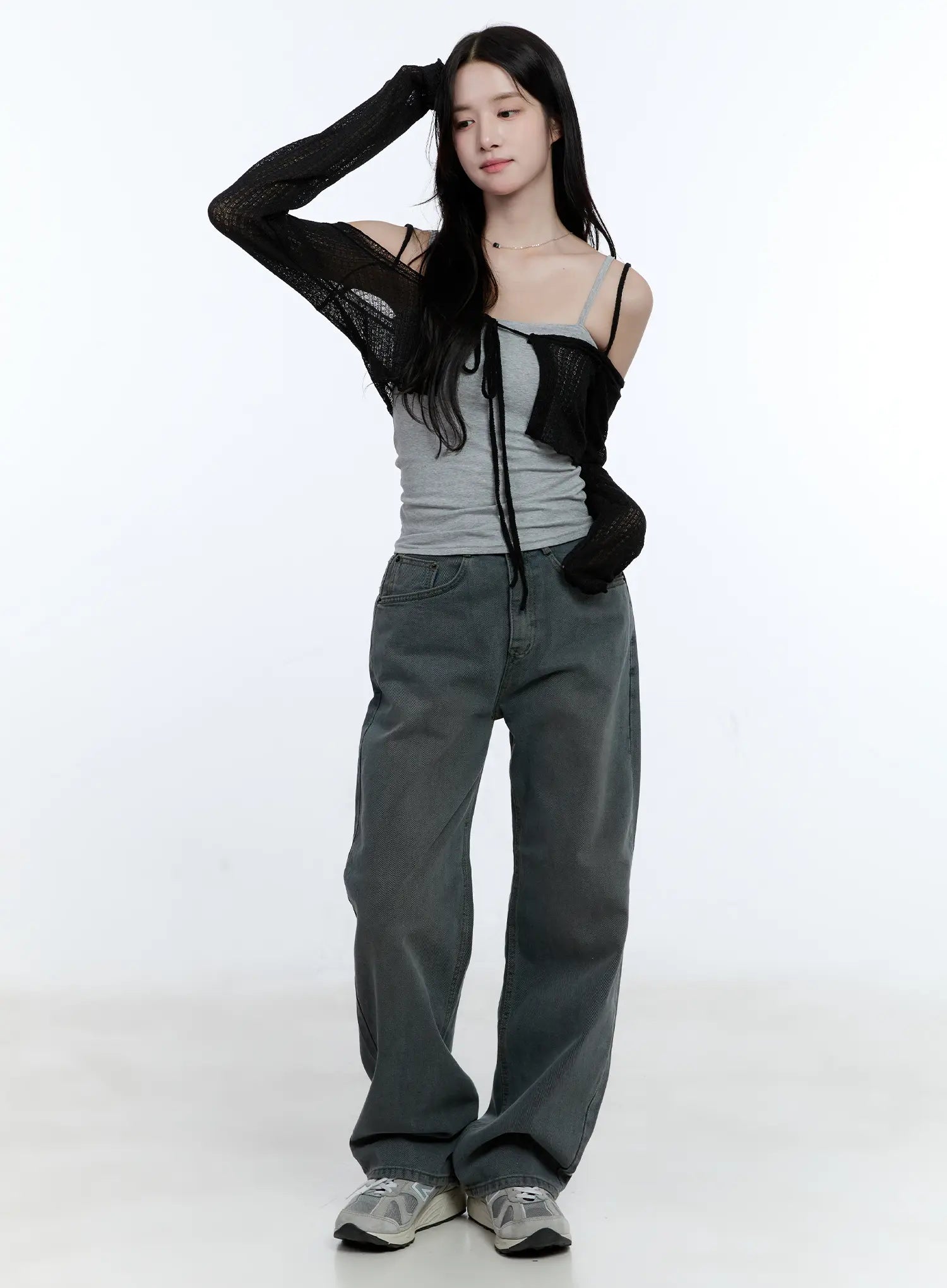 Herri Relaxed Semi-Wide Jeans CG512 in dark blue, full-body front shot on model, relaxed semi-wide washed denim styled with gray cami and black open-knit cardigan and sneakers.
