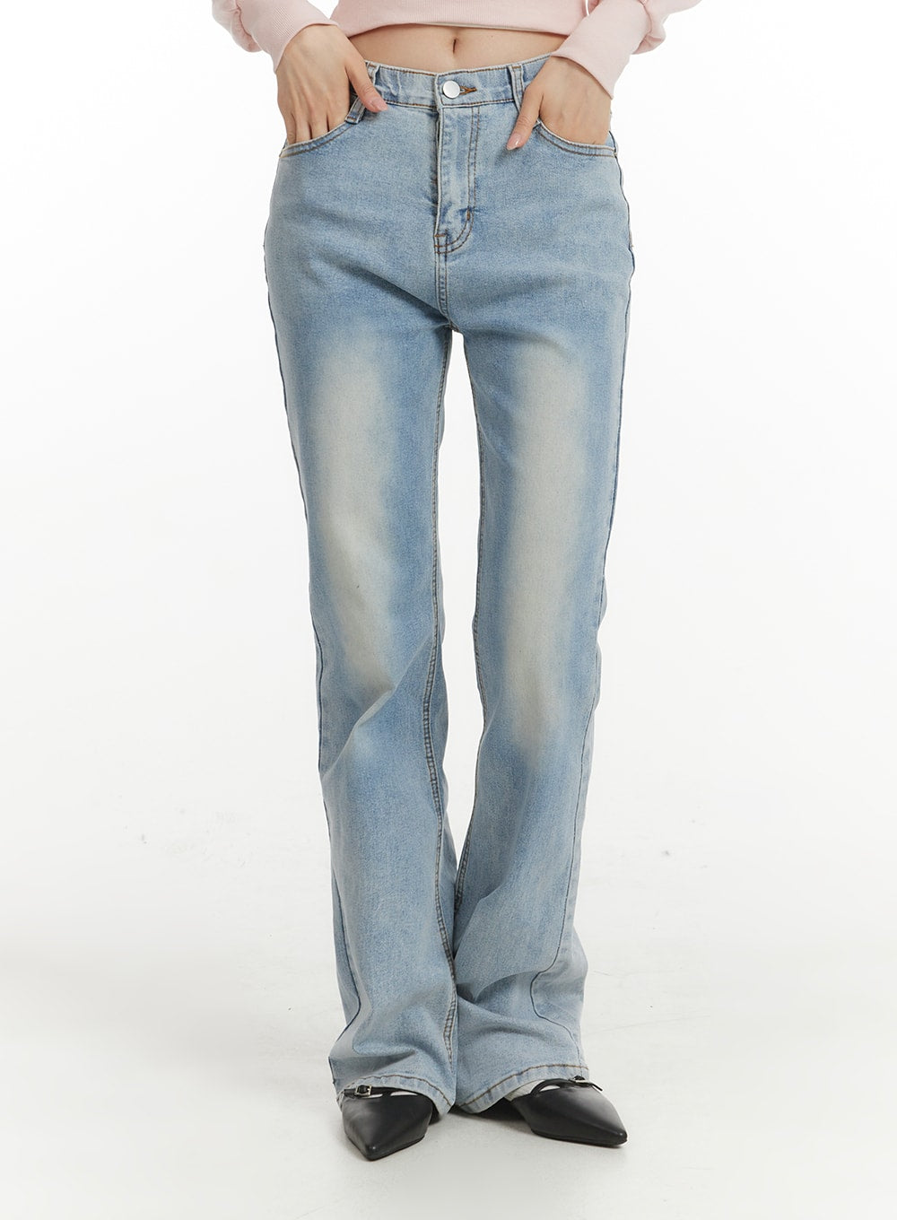 Light Washed Bootcut Jeans OF427 in light blue, front mid-shot on model, high-waist slim fit with washed fading, button closure and front pockets, slight bootcut flare at hem.