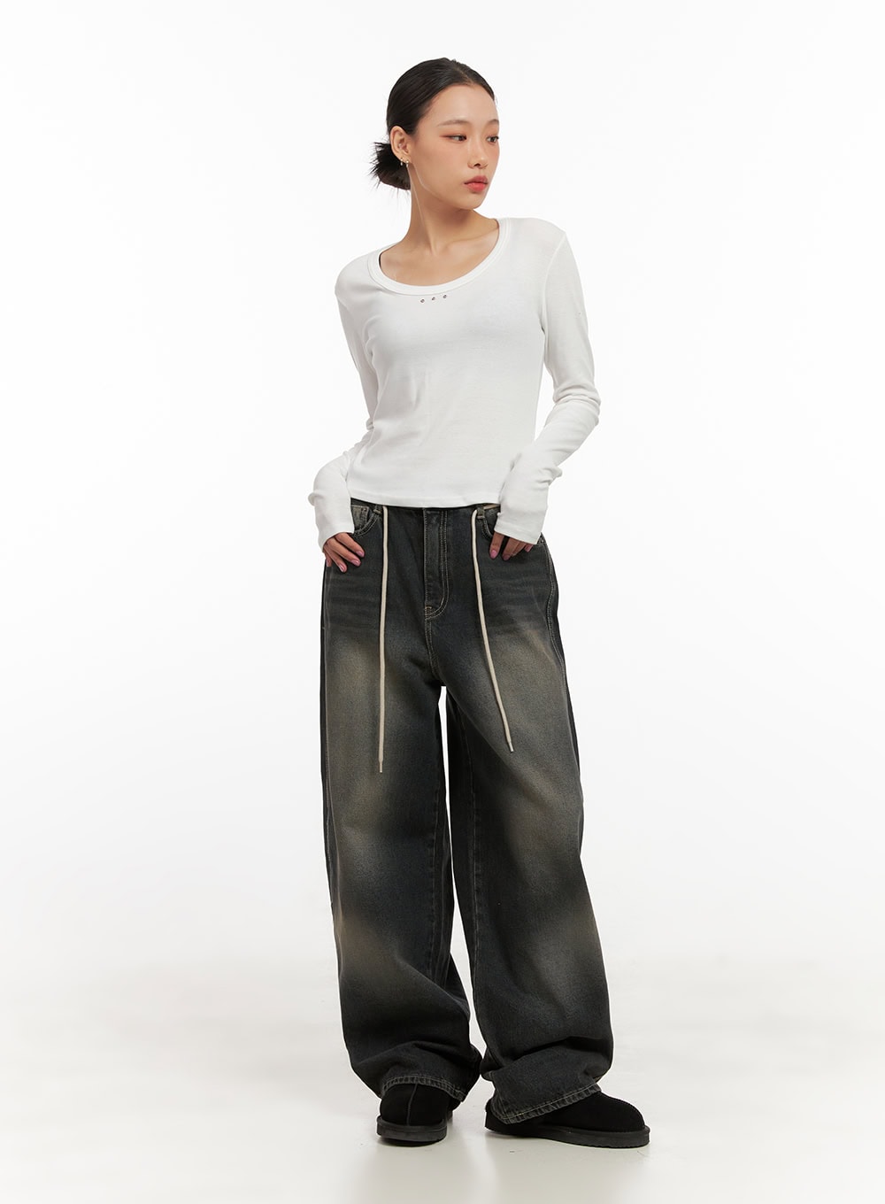 Matilda Washed Denim String Baggy Jeans CD410 in black, full-body front on model, ultra-wide baggy leg with washed fade, paired with white scoop-neck long-sleeve top and shearling slides.