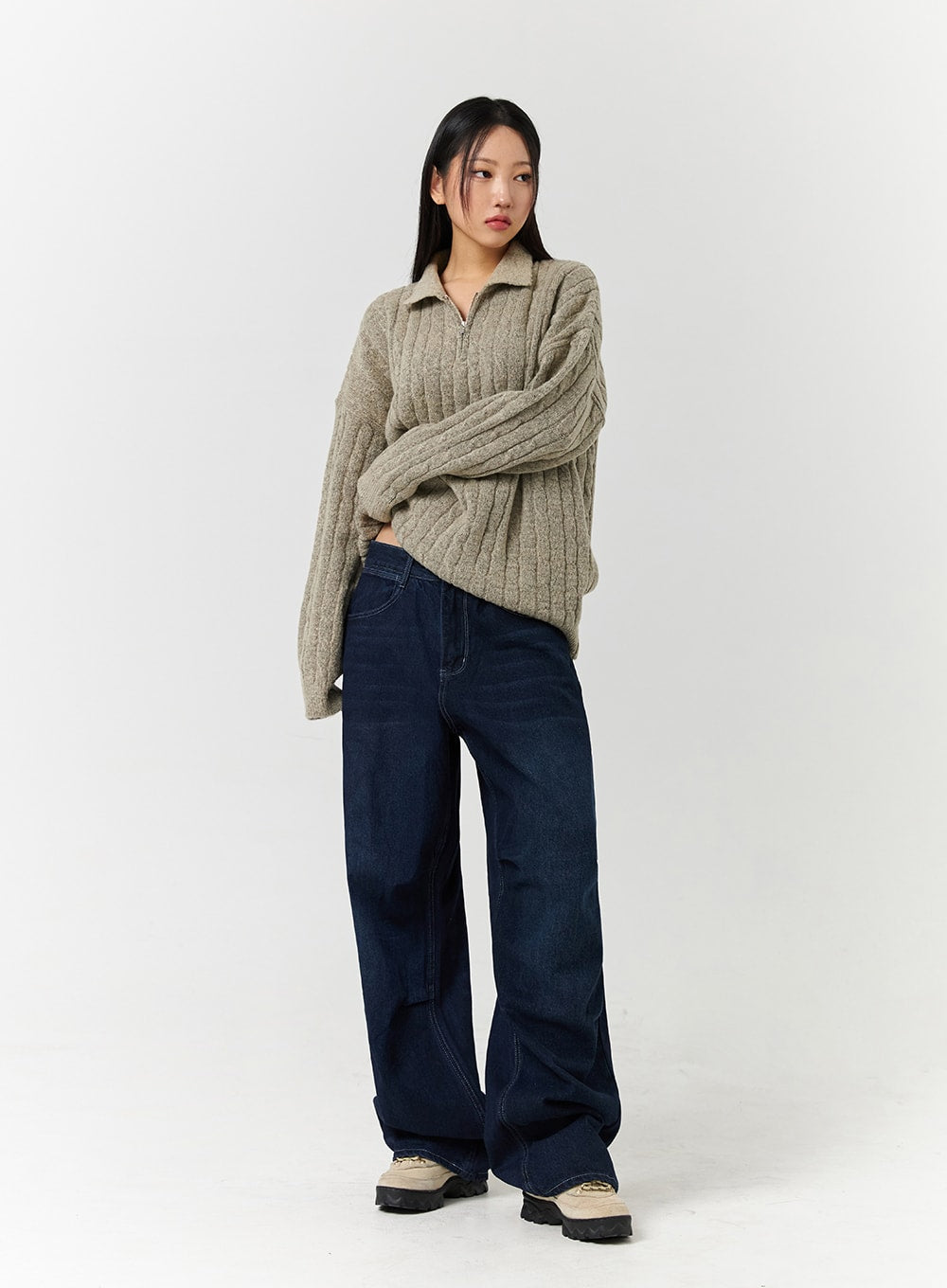 Unisex High Waist Solid Pocket Straight Leg Jeans CD328 in Blue, three-quarter front view on model with arms crossed, wide-leg dark denim with contrast stitching, styled with oatmeal ribbed half-zip sweater.