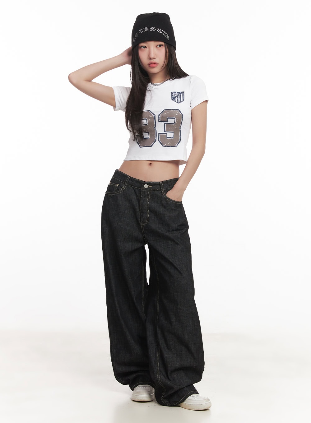 Fenna Baggy Jeans CA529 in black, full-body front on model wearing beanie and white crop tee, ultra-wide leg denim street style look.