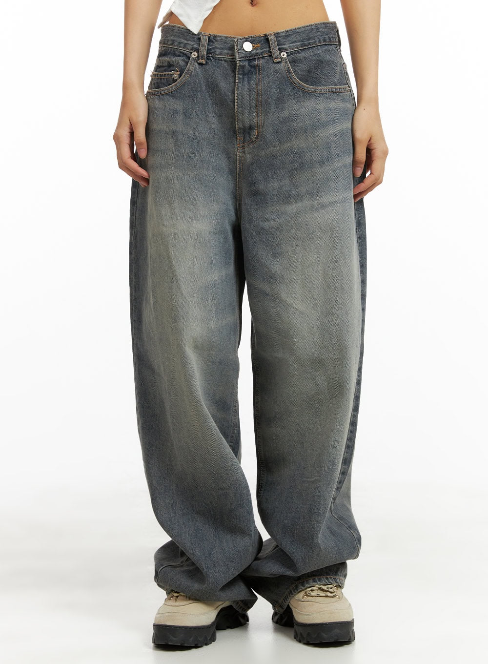 Vintage Washed Baggy Jeans CA424 in blue, front waist-to-hem close-up on model, wide-leg silhouette with faded wash, visible stitching and button fly, extra-long hem pooling at feet.