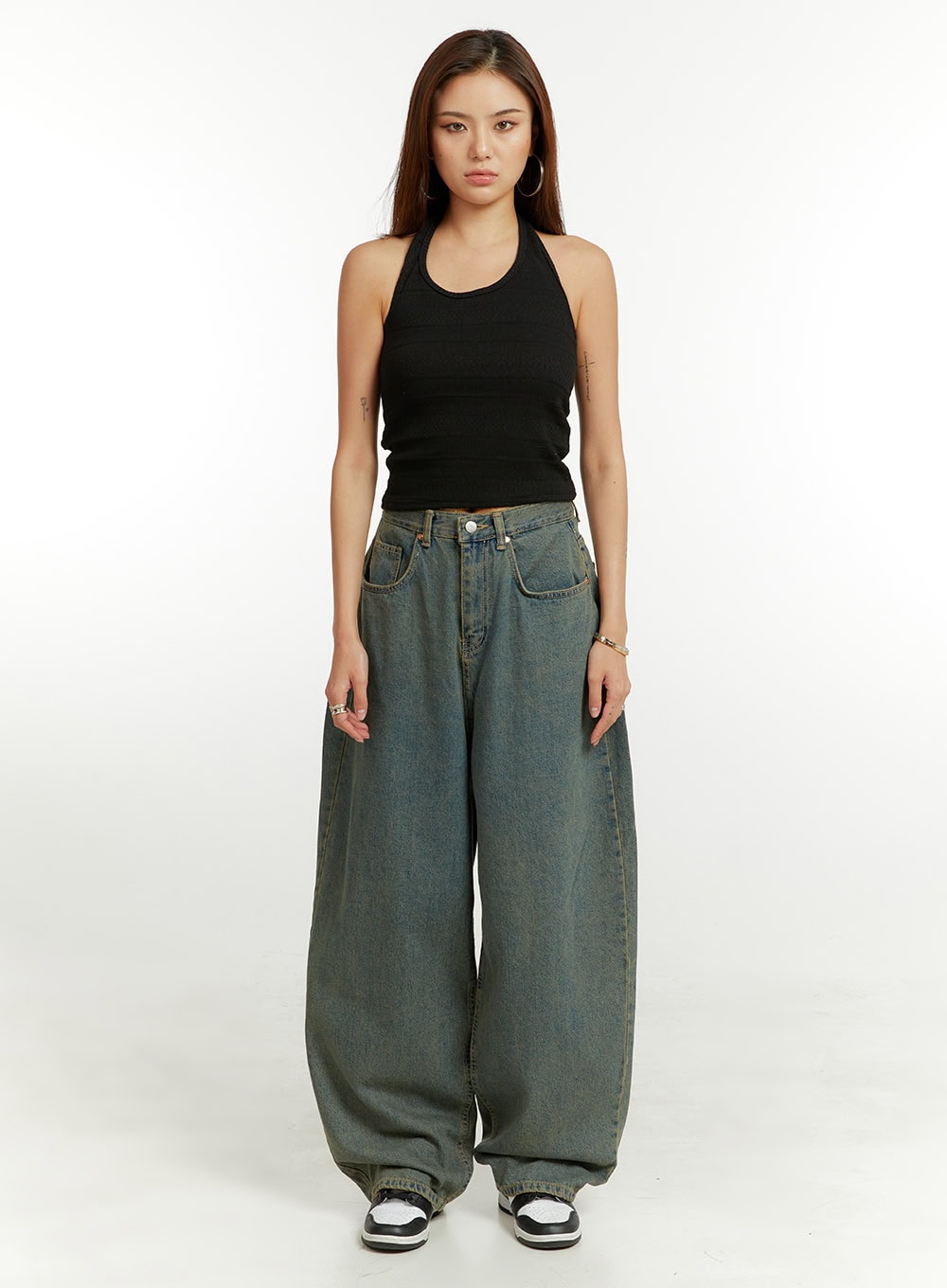Denim Washed Baggy Jeans CU424 in blue, full-length front view on model, wide-fit washed denim with voluminous balloon leg, styled with black halter crop top and sneakers.