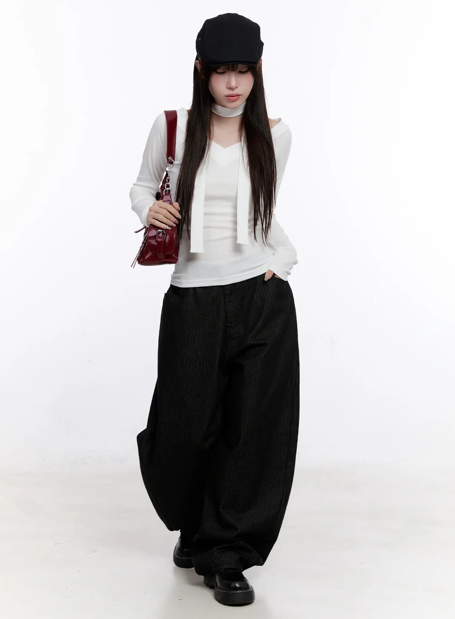 Vada Stitched Wide Leg Jeans CS530 in Black, full-body styled shot on model, voluminous wide-leg cotton denim paired with white long-sleeve top, black cap, and burgundy shoulder bag.