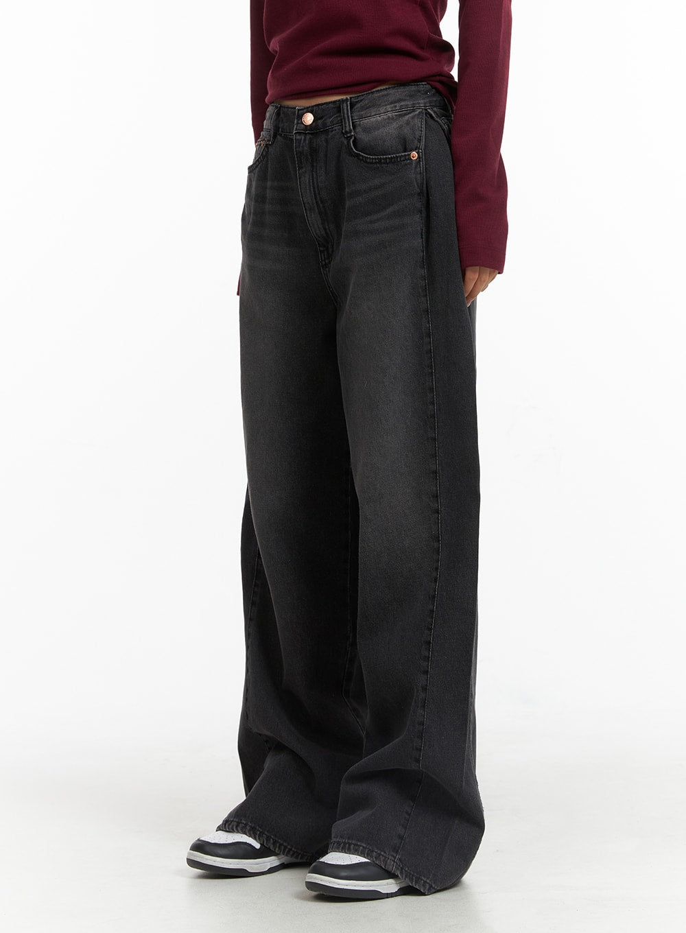 Washed Denim Wide-Leg Jeans CJ426 in black, side view on model, wide-leg silhouette with washed cotton denim, high waist, paired with burgundy top and sneakers.