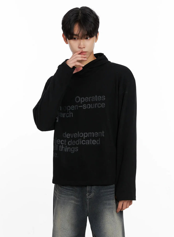 Men's Lettering Hand Warmer Hoodie IO517 in black, upper-body close-up on model, tonal lettering print across chest, relaxed fit with hood, paired with faded denim jeans.