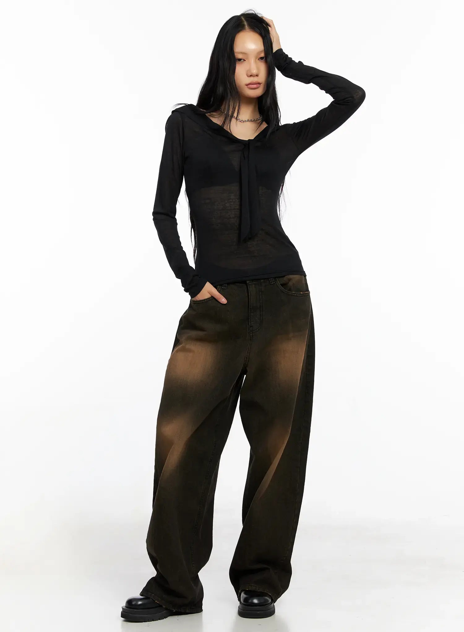 Analia Washed Wide-Leg Jeans CO529 in brown, full-body front shot on model, styled with sheer black tie-neck long sleeve top and black loafers, street casual acubi look.