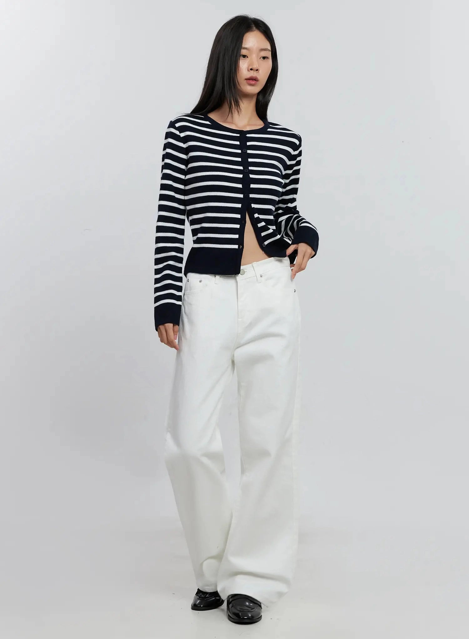 Taytum Straight-Leg Jeans IS515 in white, full-body front view on model, relaxed straight-leg cotton denim styled with navy striped cardigan and black loafers.
