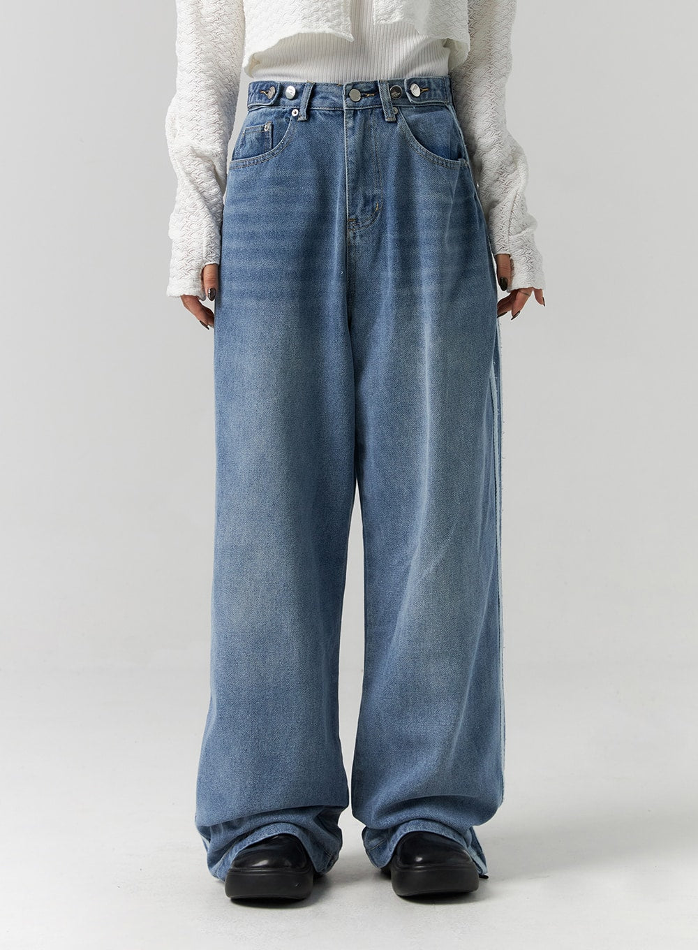 Side Stripes Wide Leg Jeans CS314 in blue, front waist-to-hem close-up on model, showing multi-button high waistband and wide-leg washed denim silhouette, pooling at hem.