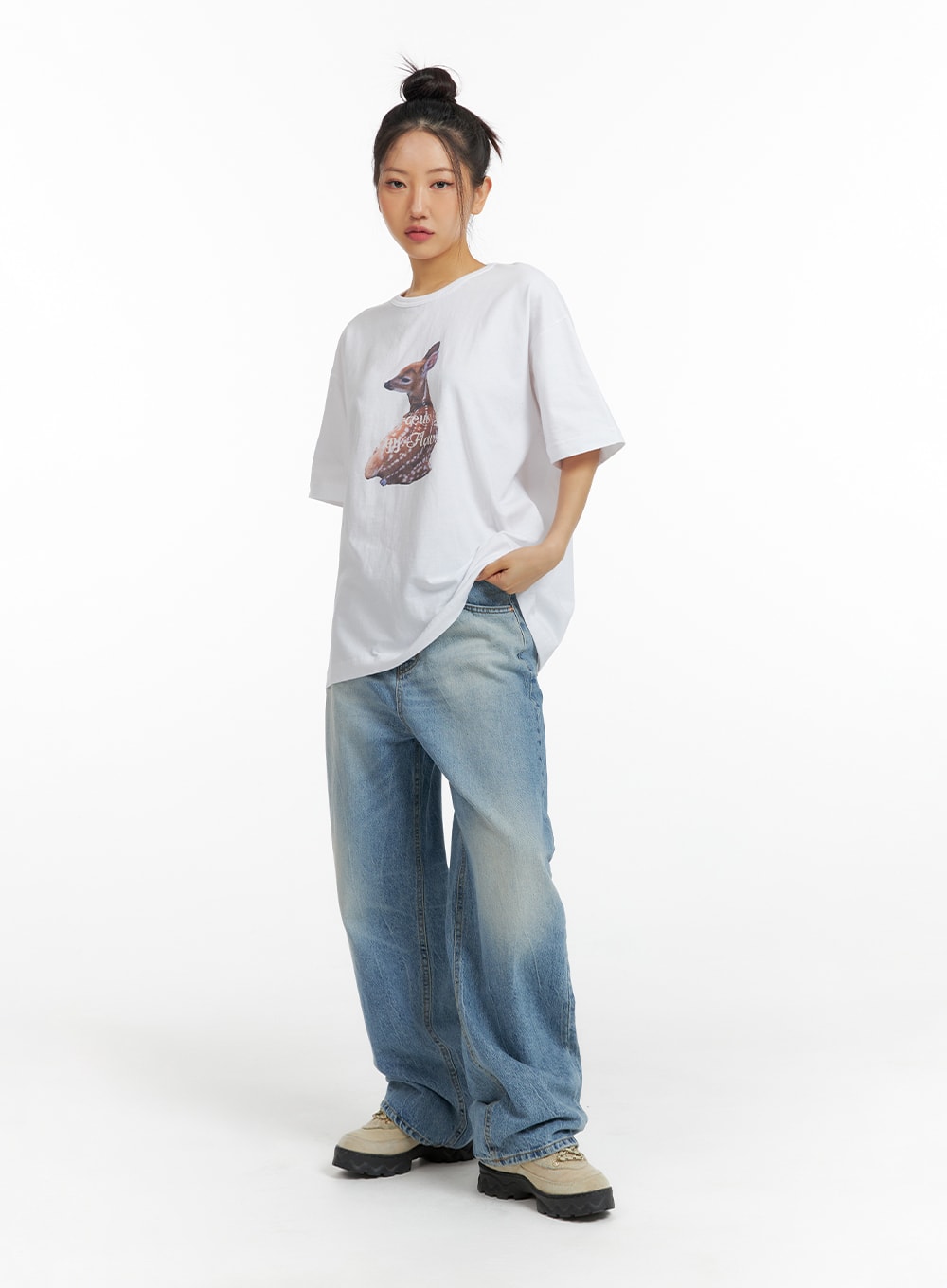 Washed Wide-Leg Jeans CF419 in blue, full-body front view on model, relaxed wide-leg silhouette with washed finish, styled with white deer-print oversized tee and lug-sole sneakers.