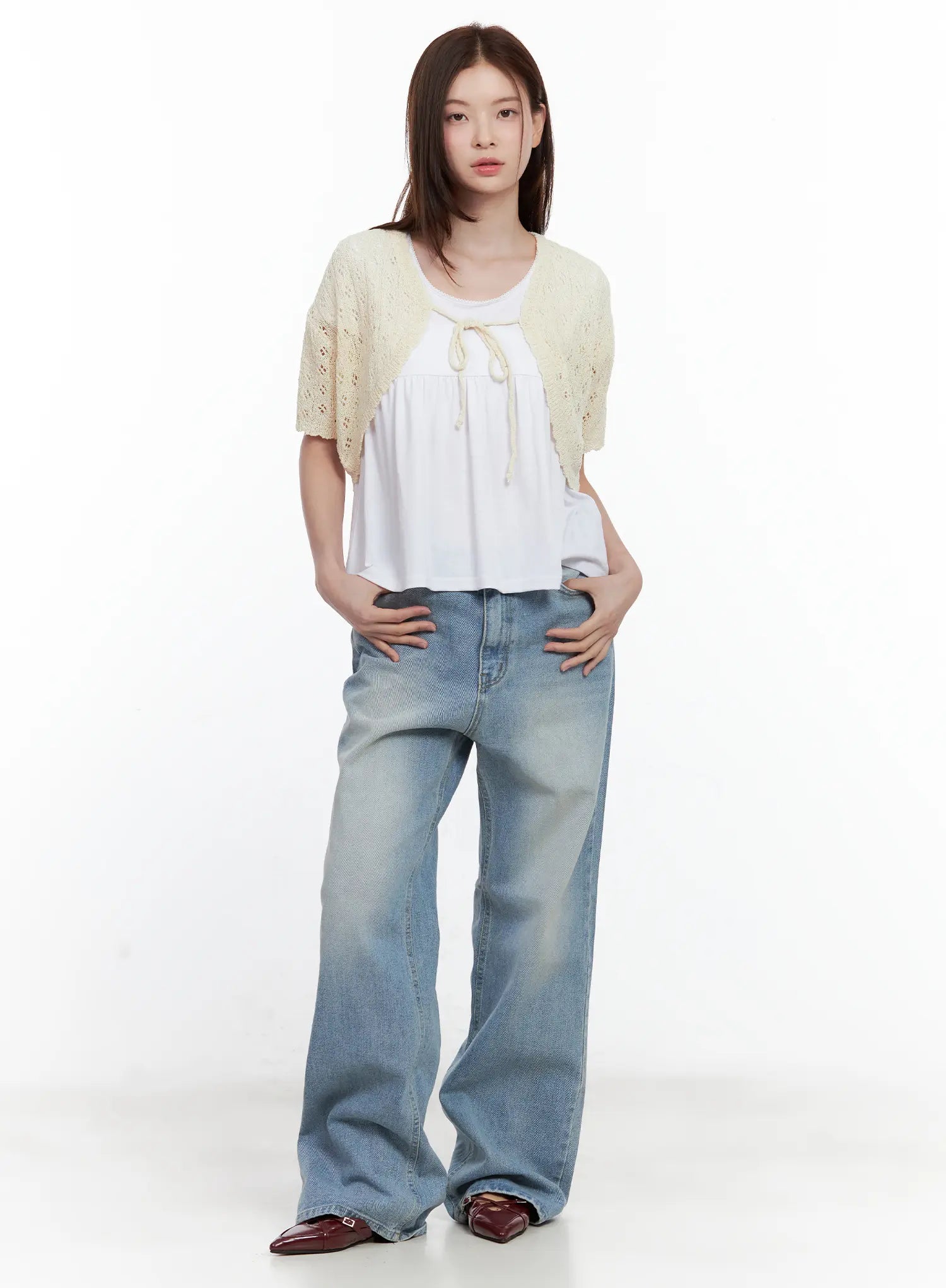 Ina Slouchy Fit Jeans CL502 in blue, full-body front shot on model, loose wide-leg washed denim, styled with cream crochet shrug and white smock top, burgundy loafers.