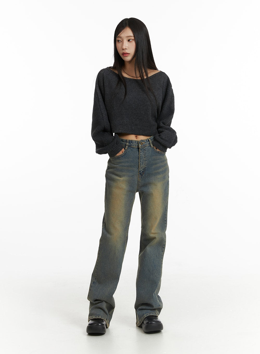 Washed Slim Fit Bootcut Jeans CJ431 in blue, full-length front on model, styled with dark grey ribbed crop knit sweater and black platform shoes, slim fit with warm yellow washed fading throughout.