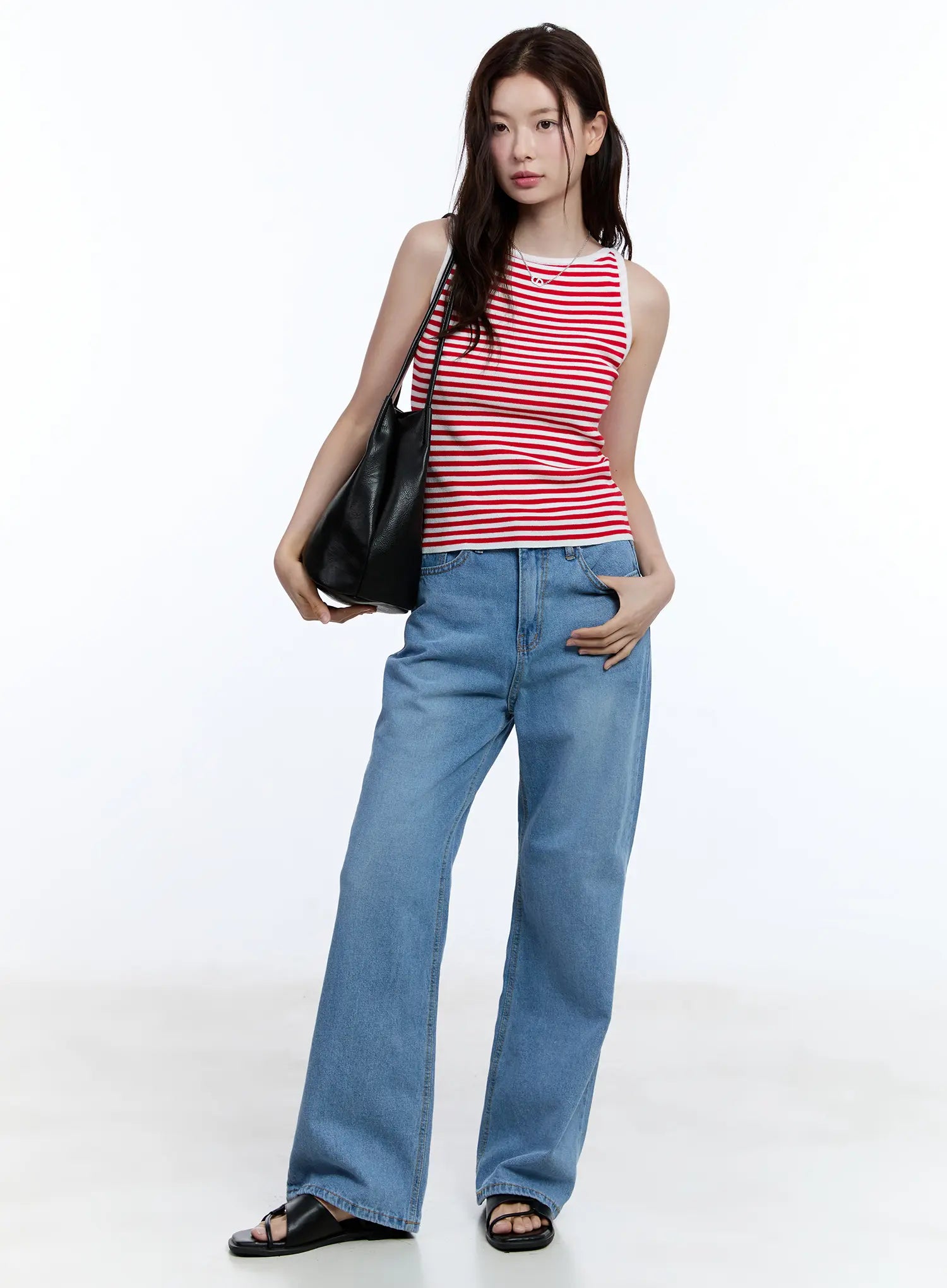 Jisoo Straight-Fit Jeans CU513 in blue, full-body front shot on model, wide-leg washed denim styled with red striped tank and black leather tote bag.