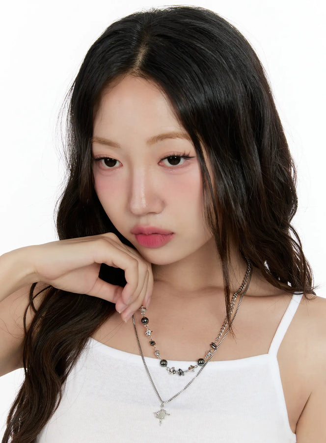 Layered Bead Necklace CG501 in silver, front portrait on model, layered chain necklace with hematite beads and star pendant, K-pop street style, white cami top.