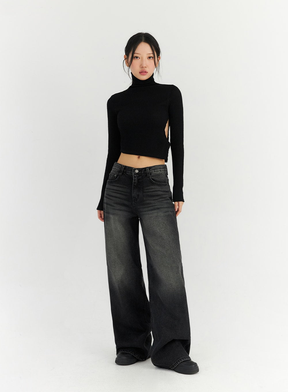 Back Slit Washed Wide Leg Jeans CN306 in Black, front full-length shot on model, low-waist wide-fit washed denim pooling at floor, paired with black crop turtleneck knit and platform shoes.