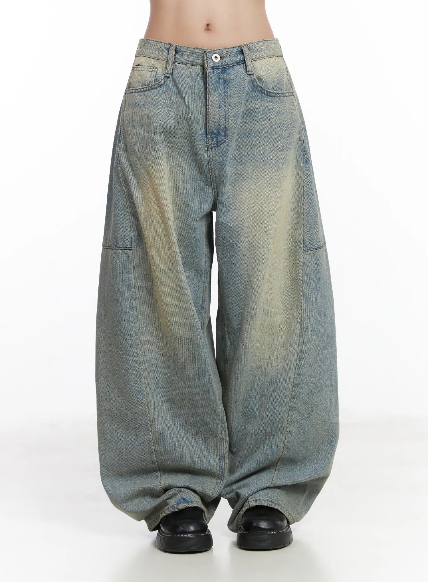 Lyla Washed Wide Leg Jeans CD530 in light blue, front product shot on model, low-rise waistband with button closure, wide balloon silhouette and faded washed cotton denim, pooling at hem.