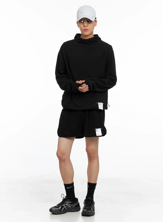 Men's Embroidered Baseball Cap IS502 in light gray, full-body front on model wearing sunglasses, styled with black hoodie, matching shorts, and chunky sneakers.