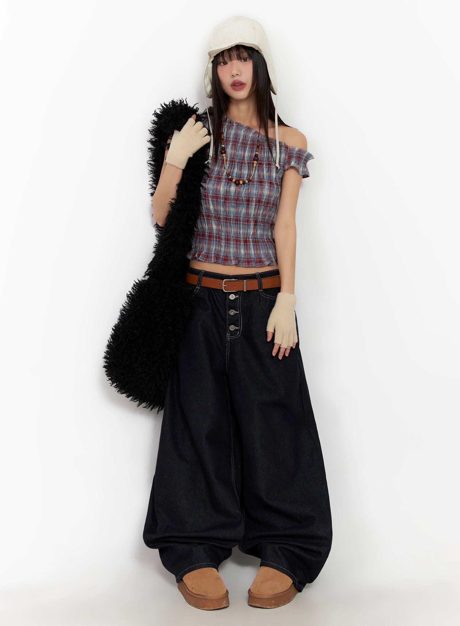 Jazlyn Non-Fade Button Wide Leg Jeans IN503 in dark blue, full-body editorial on model wearing plaid off-shoulder crop top, cream bucket hat, brown belt, and carrying a black fluffy bag.