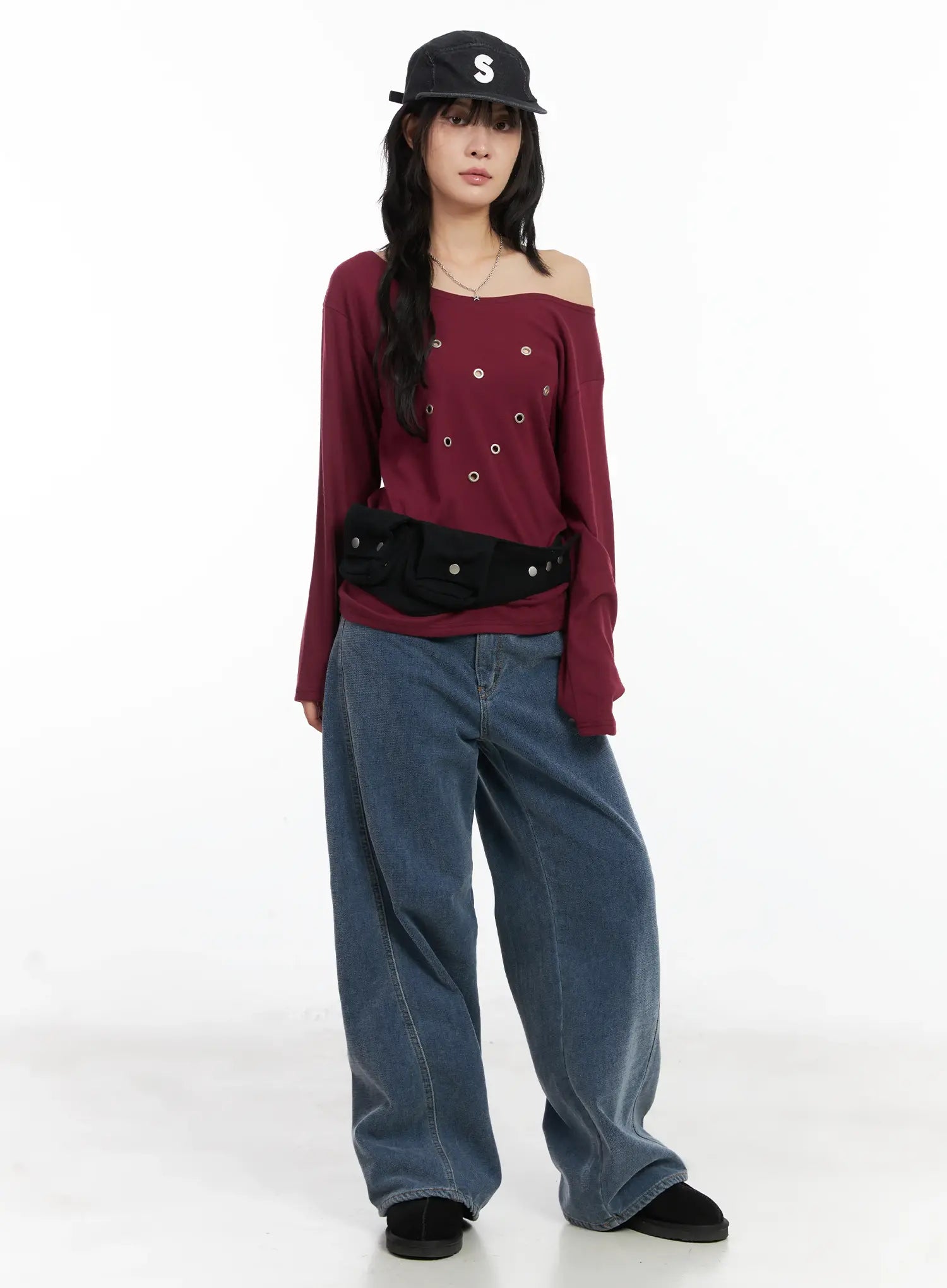 Norah Oversized Jeans CN528 in blue, full-body front styling shot on model wearing burgundy off-shoulder top and black cap, relaxed wide-leg silhouette.