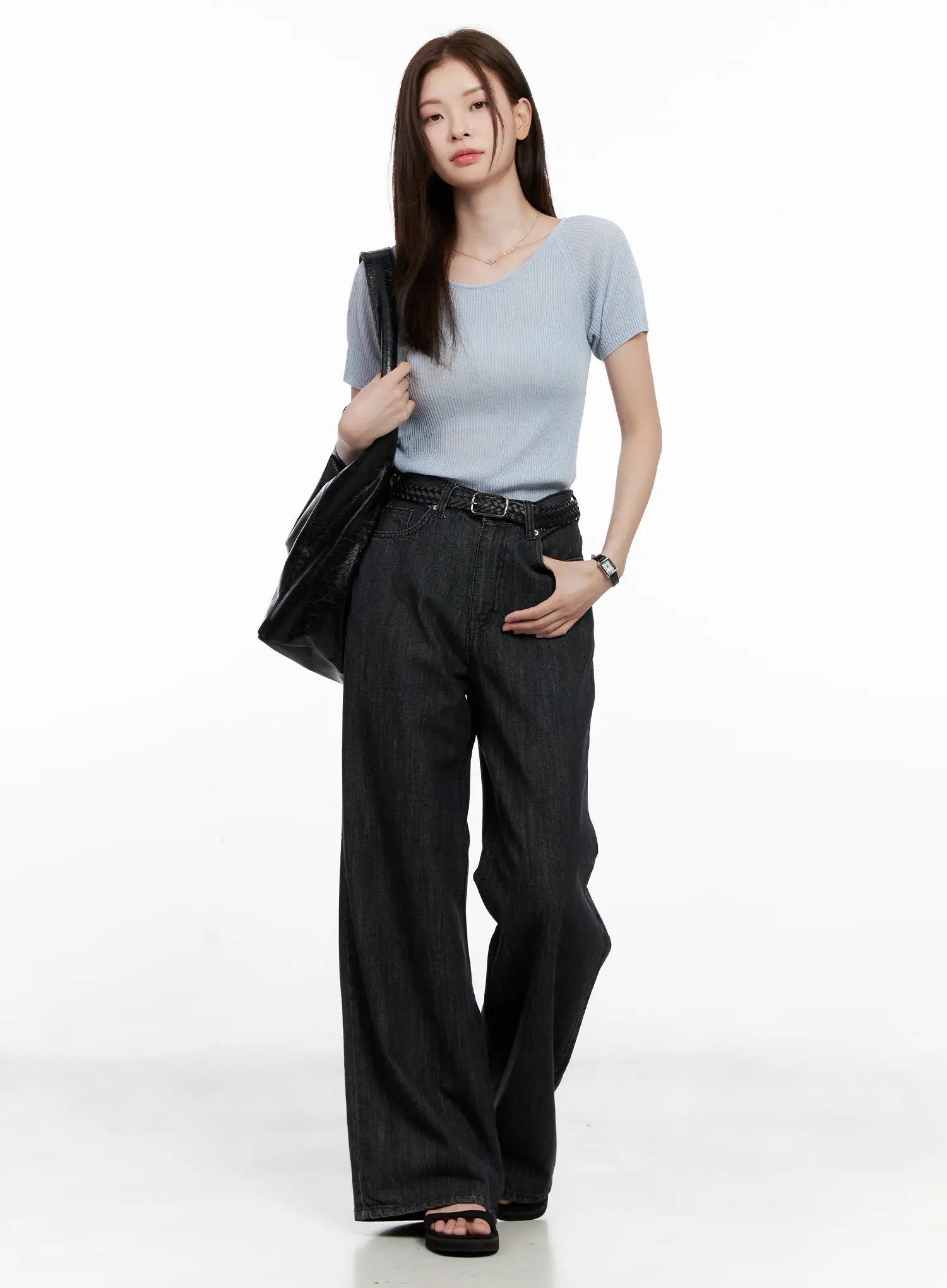 Yeon High-Waist Wide Jeans CL523 in black, full-body front shot on model with light blue ribbed tee, braided belt, and black tote bag, long wide-leg silhouette.