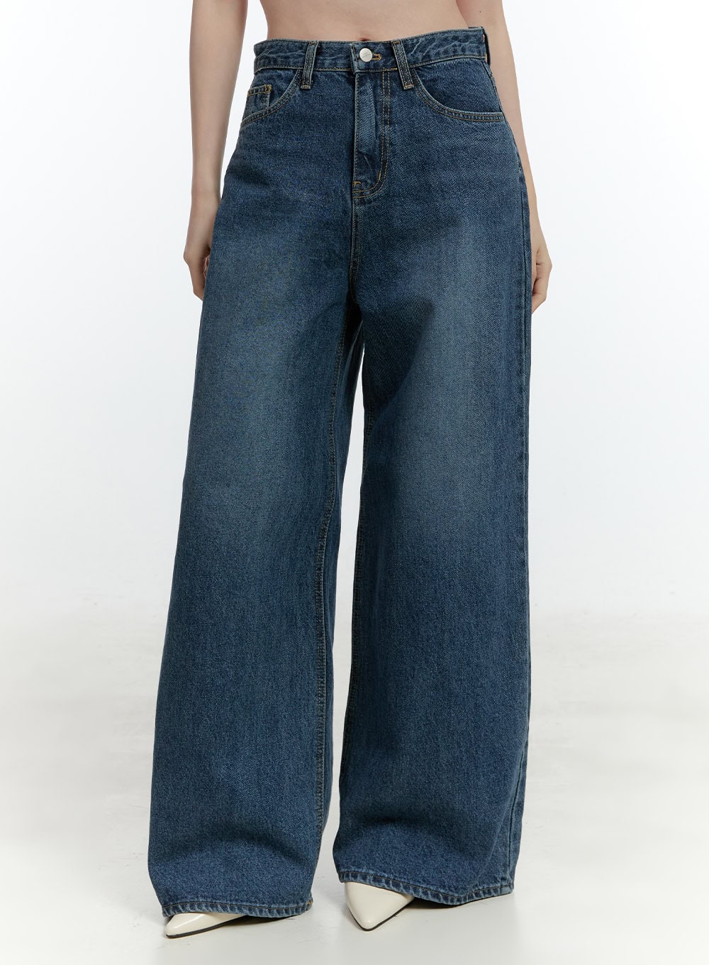 LEWKIN Klaudia Wide-Leg Jeans CF503 in blue, front close-up on model, high-waist washed cotton denim, wide-fit leg with 5-pocket styling, paired with white pointed-toe heels.