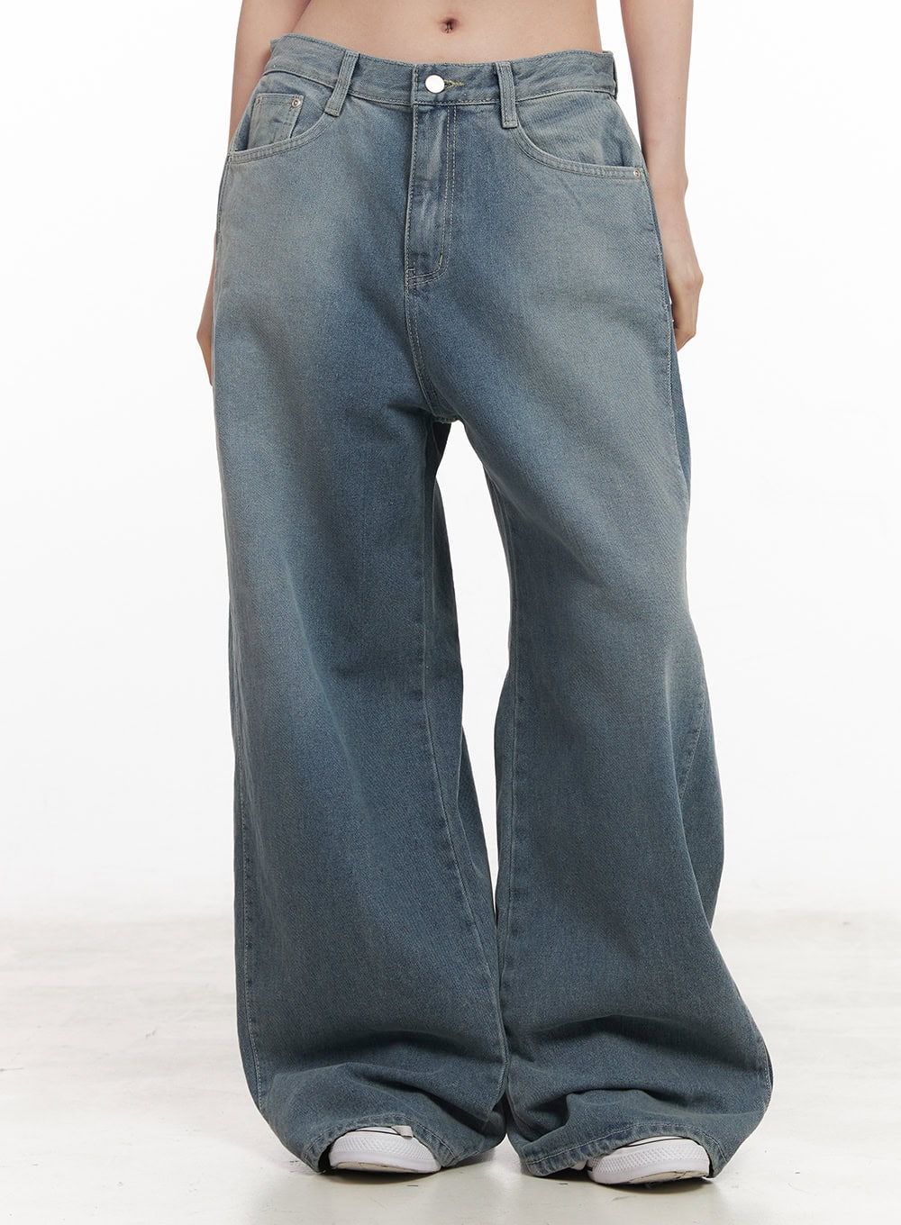 LEWKIN Amber Pintuck Wide-Leg Jeans CM511 in blue, front waist-to-hem shot on model, washed cotton denim, pintuck detail, wide-leg silhouette pooling at sneakers.