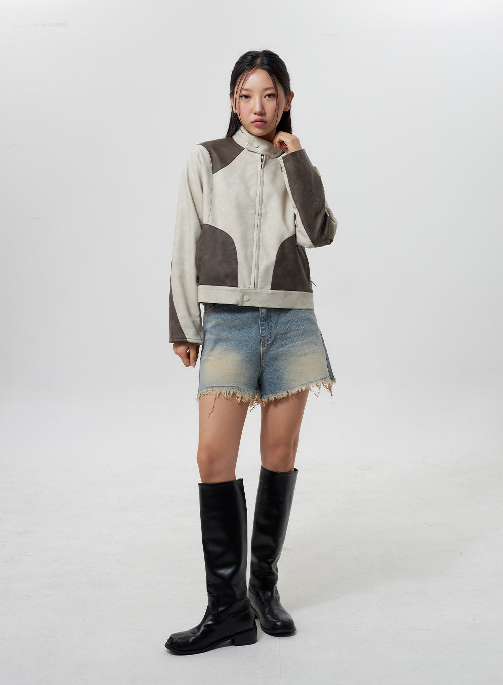 LEWKIN Mid-Rise Ripped Jeans CY323 in light blue, full-body front on model, washed frayed-hem denim shorts with vintage fade, styled with patchwork jacket and black knee boots.