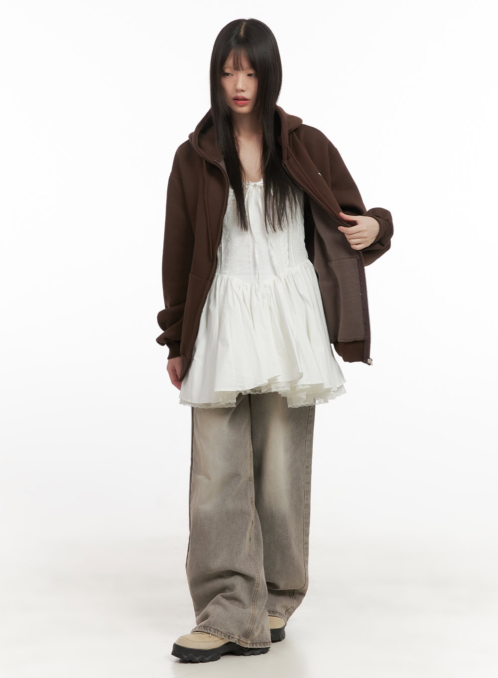 Hollie Vintage Wide-Leg Jeans CD426 in gray, full-body front shot on model, baggy washed denim styled with white lace peplum mini dress and dark brown oversized zip hoodie.