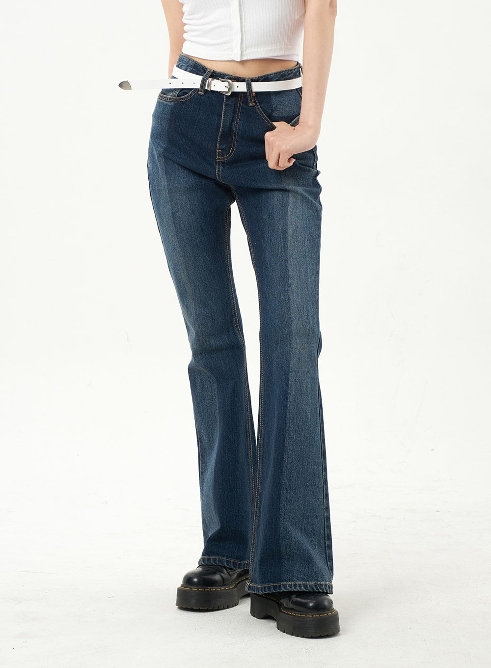 Dark Wash Bootcut Jeans CA328 in dark blue, cropped front view on model, high-rise waist with contrast topstitching and white belt, bootcut flare to ankle.