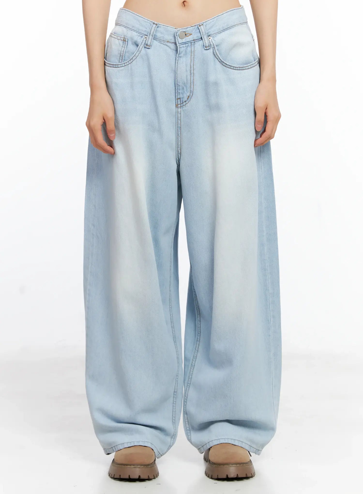 Bona Relaxed-Fit Denim Jeans CL529 in light blue, front waist-to-hem close-up on model, washed wide-leg denim with contrast stitching, front pockets, and relaxed drape over brown lug-sole boots.