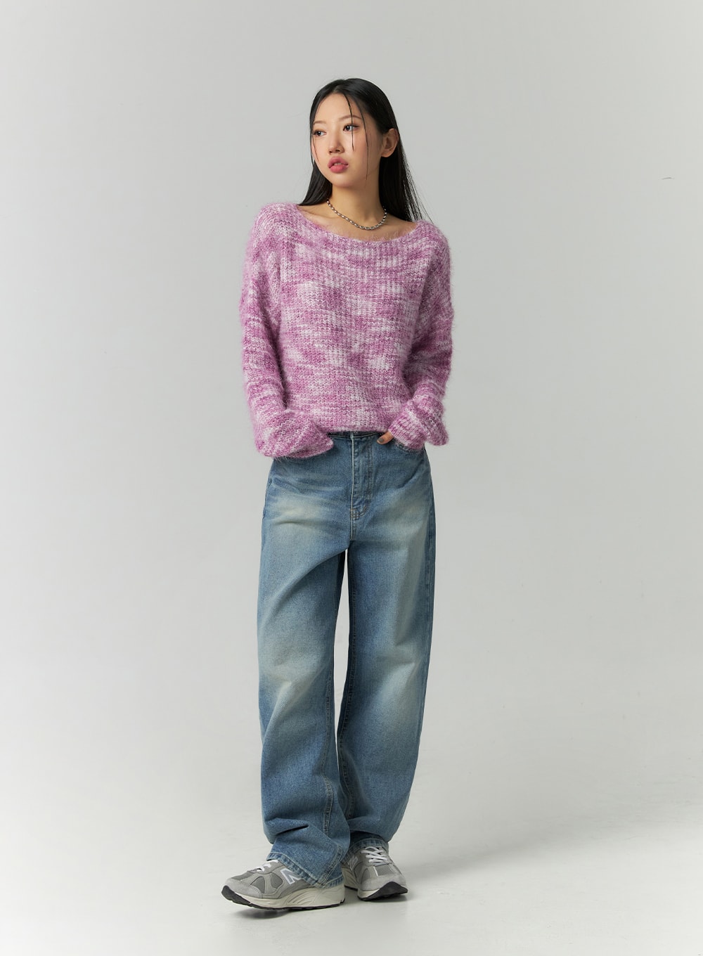 Straight Fit Jeans CN324 in blue, full front standing pose on model, wide-leg washed denim, relaxed silhouette, paired with fluffy pink marled sweater and sneakers.