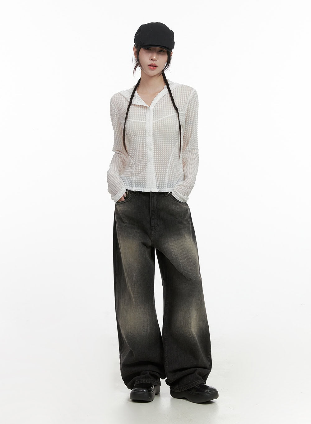 Sage Back-Buttoned Wide Pants CS430 in black, full-body front on model in black cap, floor-grazing wide-leg washed denim, styled with white semi-sheer waffle hoodie and black chunky shoes.