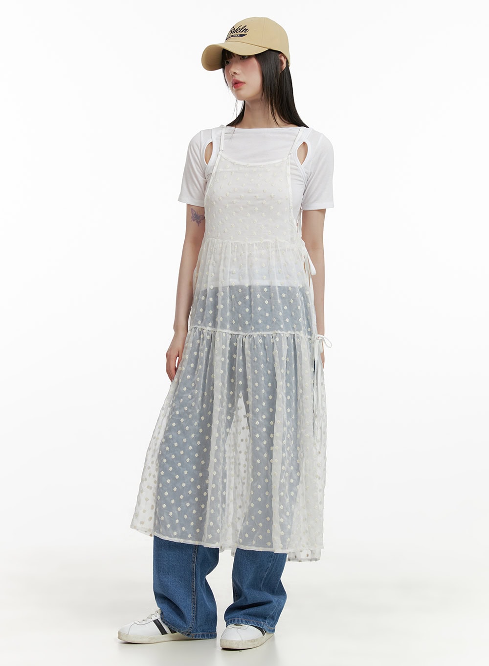 Blue Straight Leg Jeans CY428 in blue, full-body front shot on model, wide-fit washed denim layered under sheer polka-dot midi dress and white tee, with cap and sneakers.