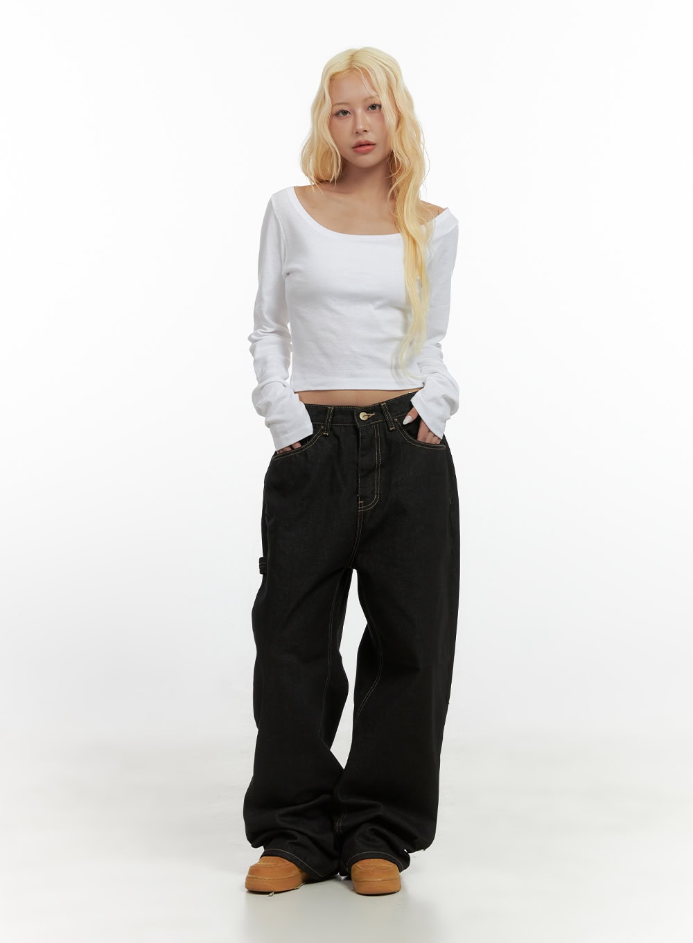 Mara Relaxed Fit Pocketed Cotton Wide Leg Jeans CS426 in black, full-body front shot on model, oversized wide-leg silhouette pooling at hem, styled with white scoop-neck crop top and tan chunky sneakers.