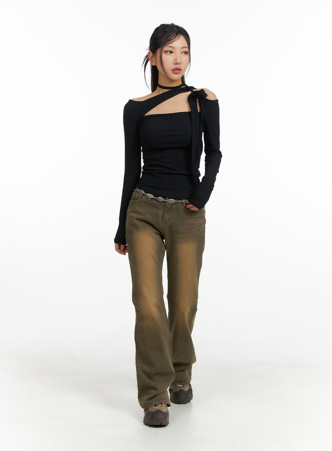 Vintage Washed Flared Jeans CM411 in dark blue, full-body front shot on walking model, tall slim bootcut silhouette with vintage brown wash, paired with black cutout top and chunky shoes.