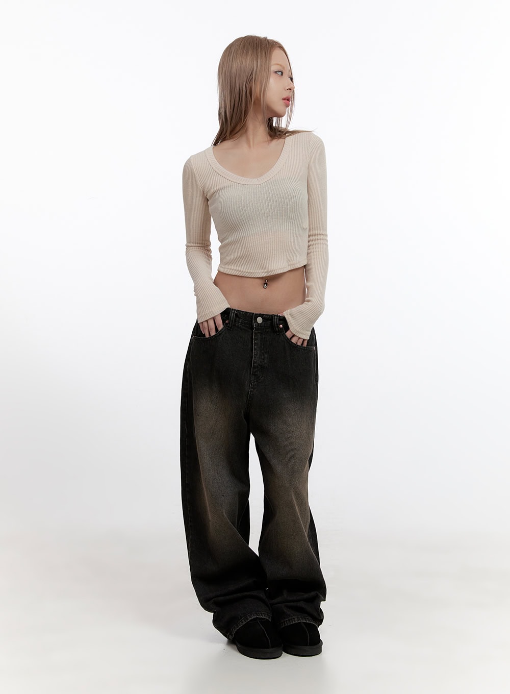 Sabina Low Waist Wide Fit Denim Jeans CN425 in Black, full-body front shot on model, low waist wide-leg washed denim paired with cream ribbed crop top and slides, street acubi style.