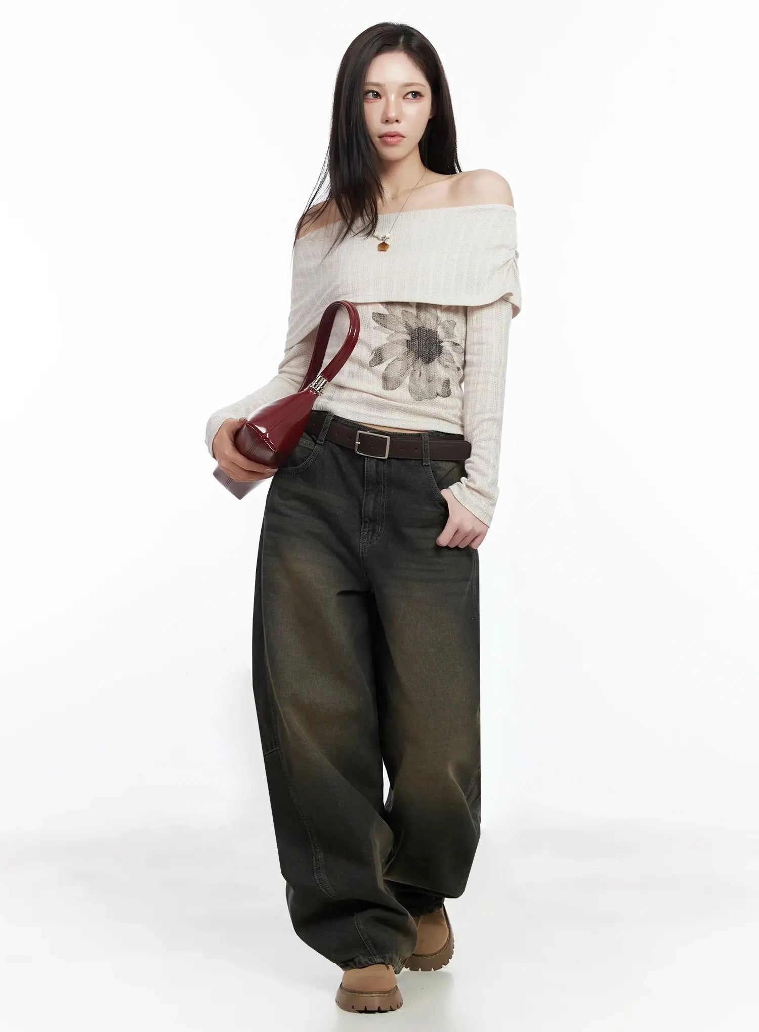 Tracey Vintage Black Washed Wide Leg Jeans IJ528 in black, full-body front shot on model, oversized wide leg silhouette, styled with off-shoulder floral knit top, brown belt, red bag, chunky boots.