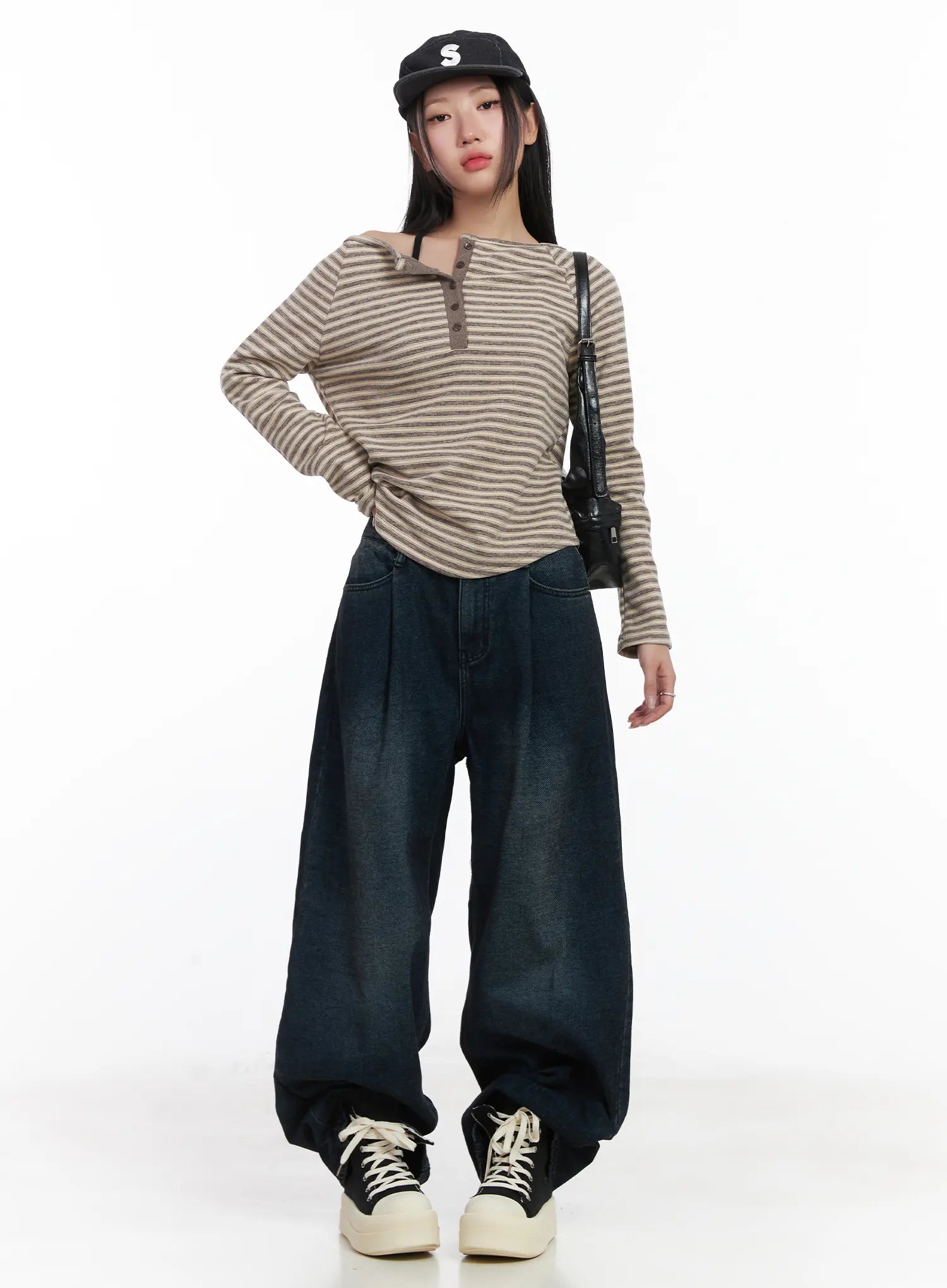 Lettie Fleece Pintuck Wide Leg Jeans CD529 in dark blue, full-body front view on model, wide-leg washed denim with pintuck detail, styled with striped top, crossbody bag, and cap.