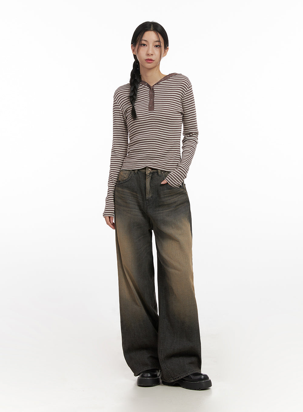 Alexa ComfyChic Washed Jeans CN428 in dark beige, full-body front shot on model, wide-leg silhouette with sun-faded washed denim, styled with a brown striped hoodie top and chunky black loafers.