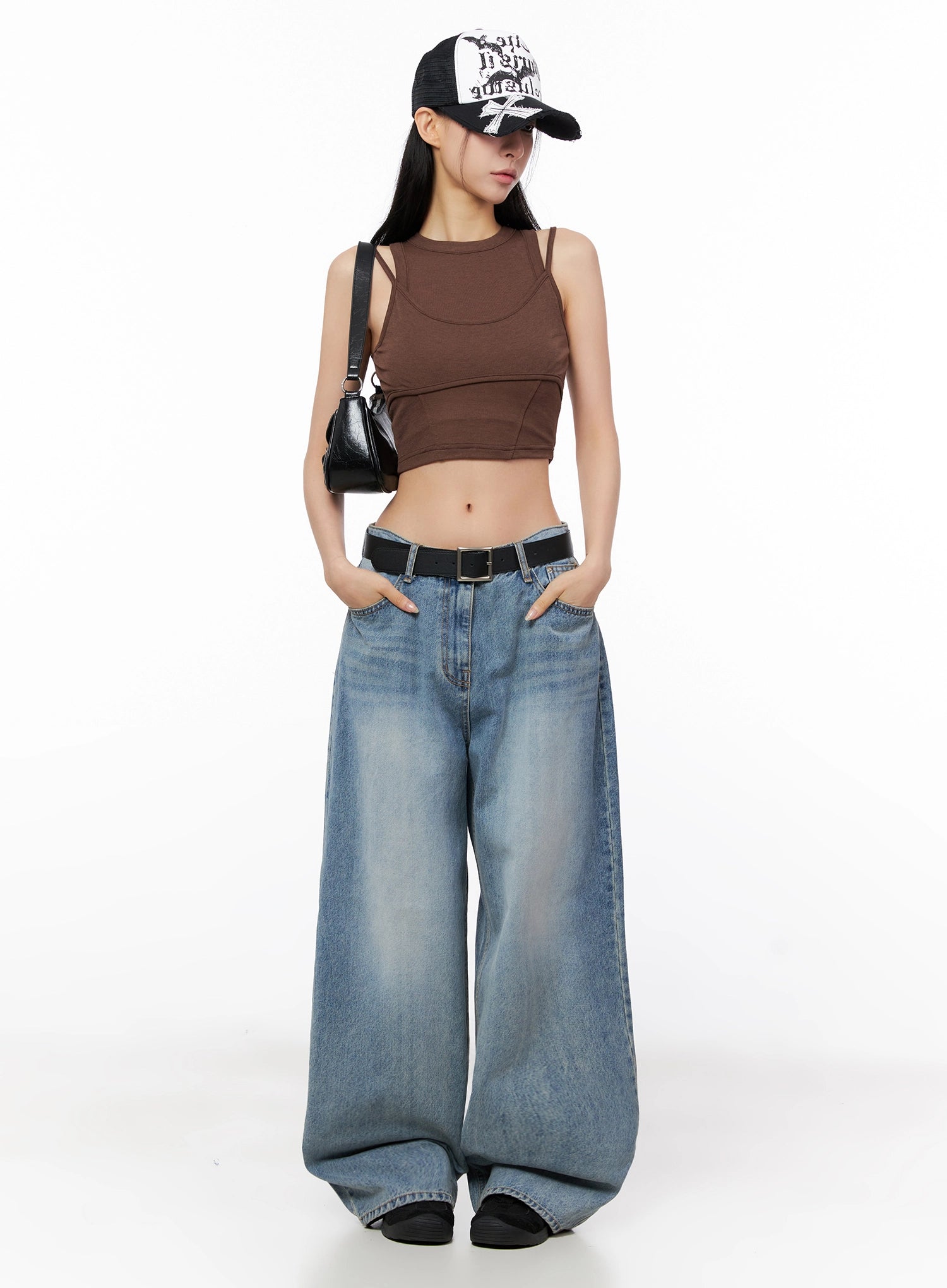 Seojin Washed Wide-Leg Jeans IG508 in blue, full-body front on model wearing brown crop top, trucker cap, black belt and mini bag, street acubi style.