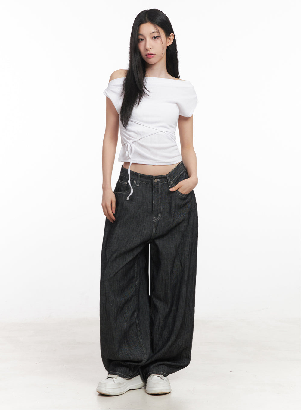 Lilli Wide-Leg Baggy Jeans IY516 in Black, full-body front shot on model, extremely wide-leg denim paired with white off-shoulder lace-up crop top and white sneakers.