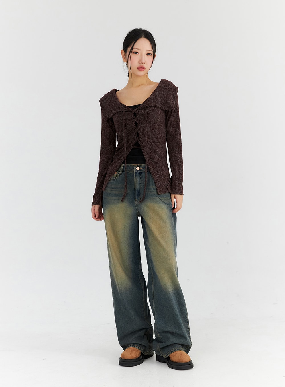 Washed Wide Leg Jeans CN315 in dark blue, front full-body shot on model standing straight, relaxed wide leg silhouette with faded yellow wash, styled with brown knit cardigan.